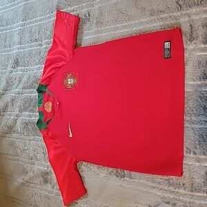 Kids soccer jersey. Portugal size medium. Boys sizing. Runs small.